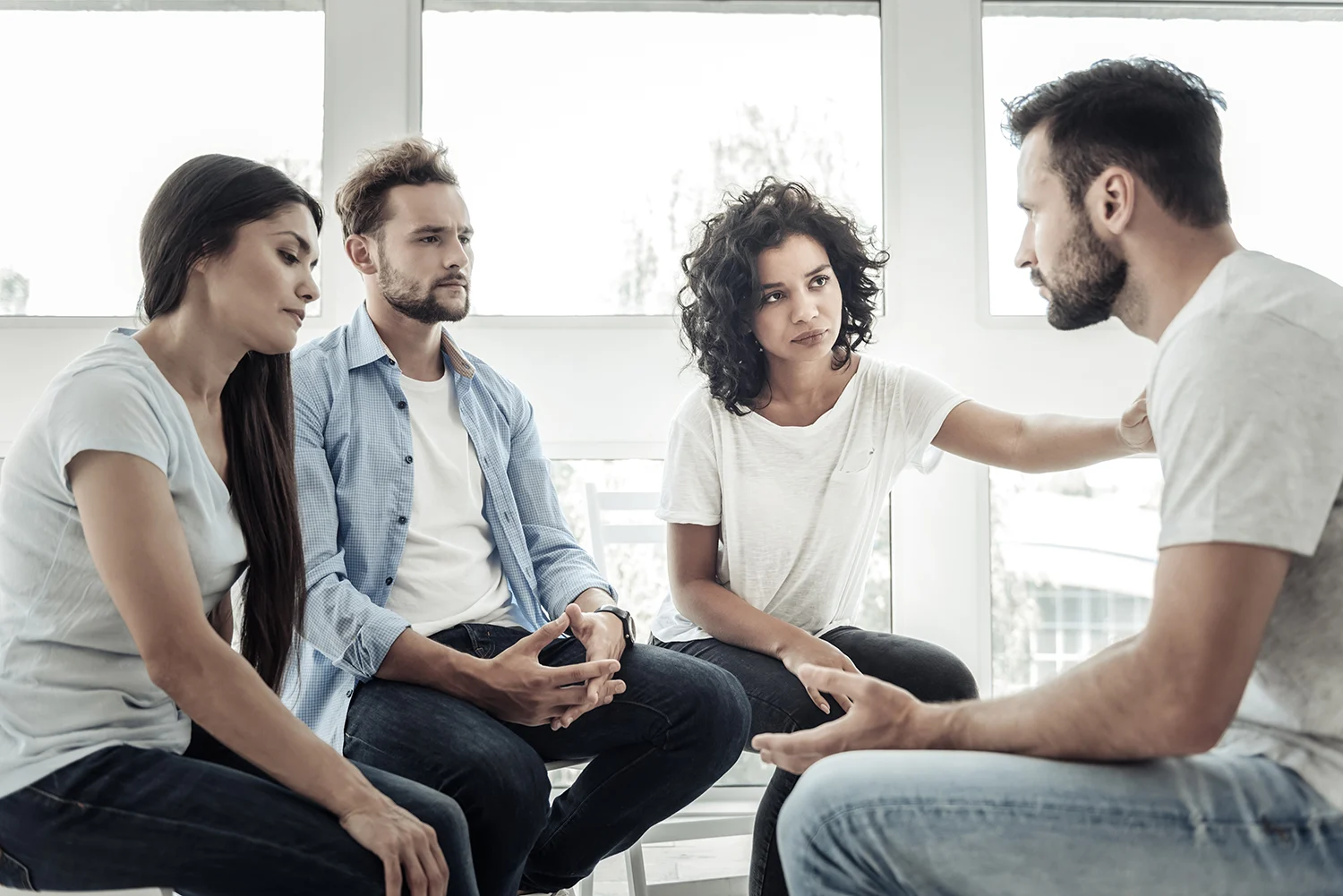 Group Support. Nice Smart Pleasant People Sitting Together And L Group support. Nice smart pleasant people sitting together and listening to their friend while expressing their support