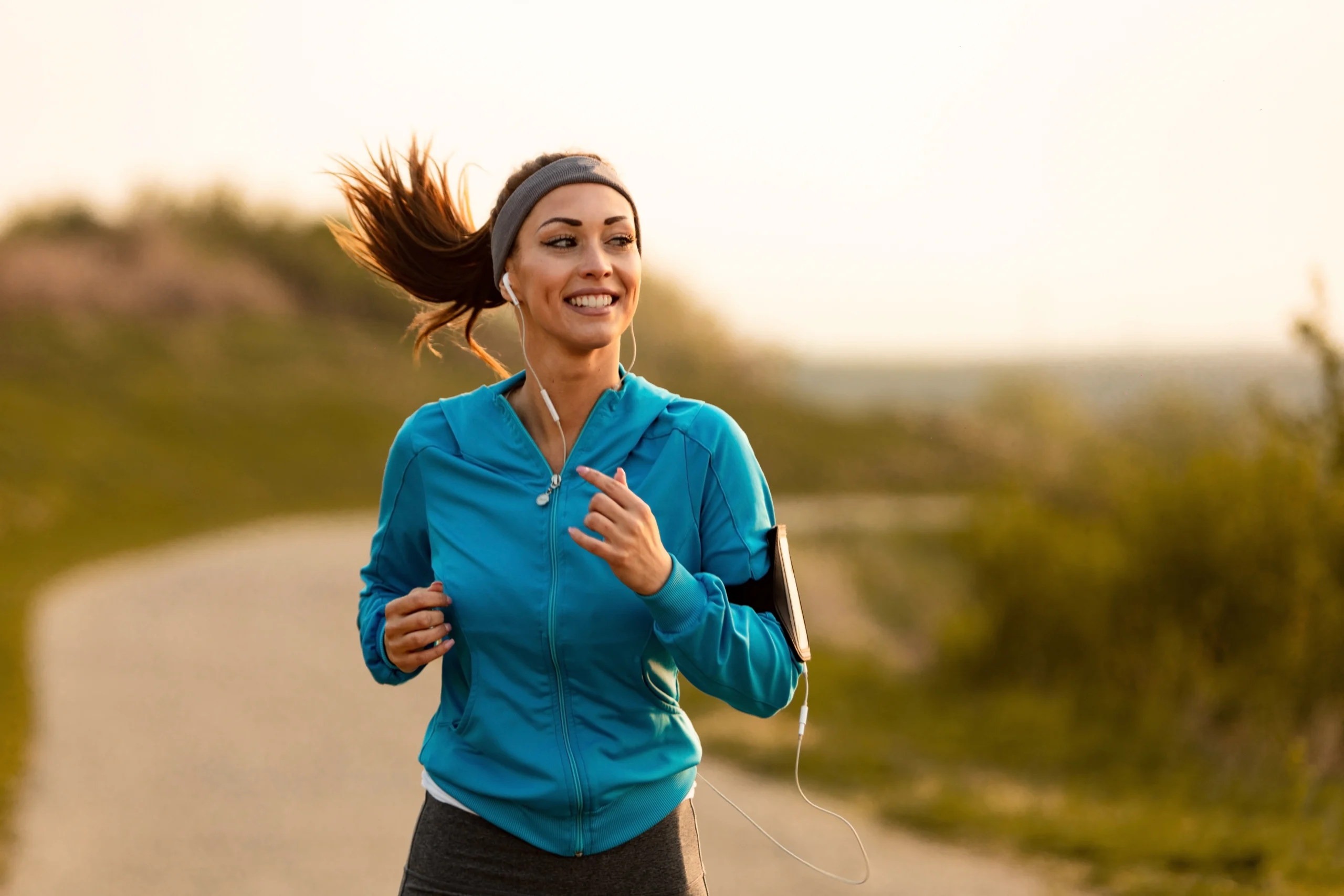 dedicated-athletic-woman-running-in-nature-and-dawn-stockpack-istock Dedicated athletic woman running in nature and dawn.