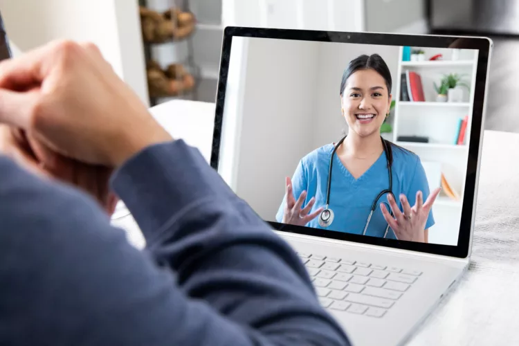 Patient at home while on video conference call with Doctor
