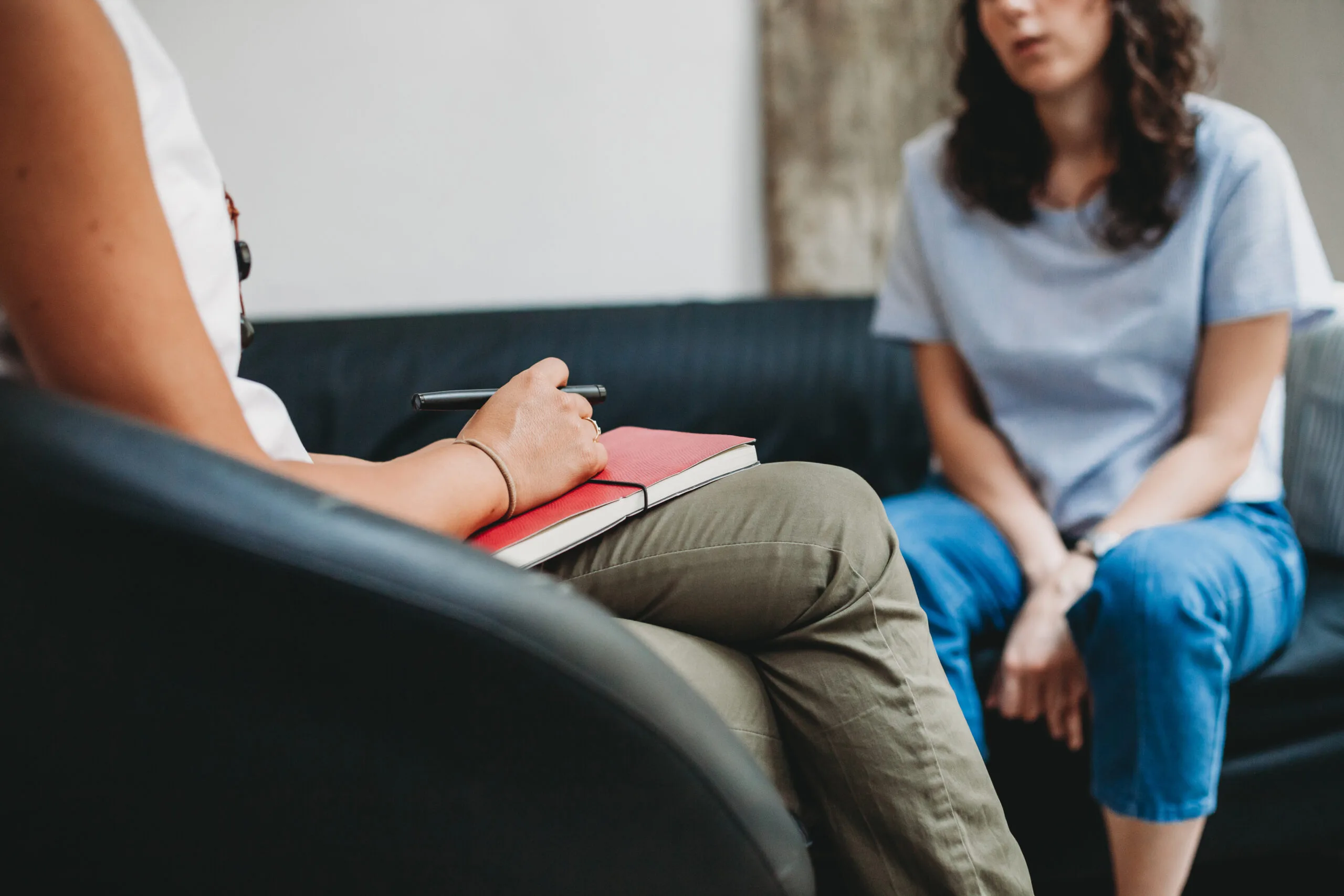 Psychotherapy session, woman talking to his psychologist in the studio