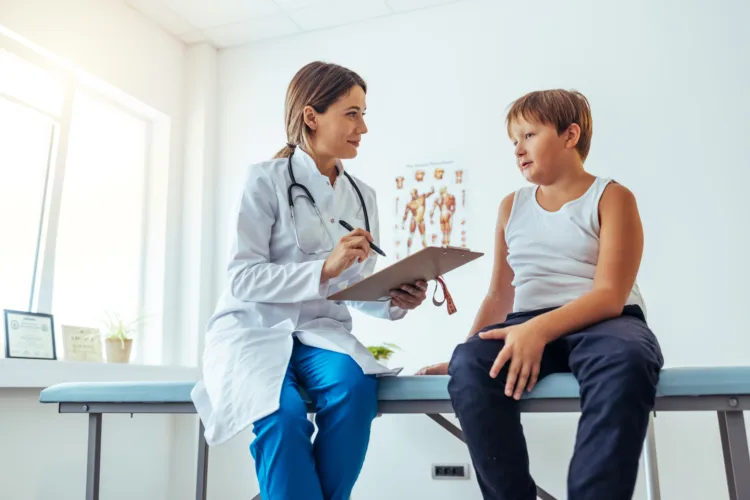 Dietitian holding diet plan during consultation with patient in the office