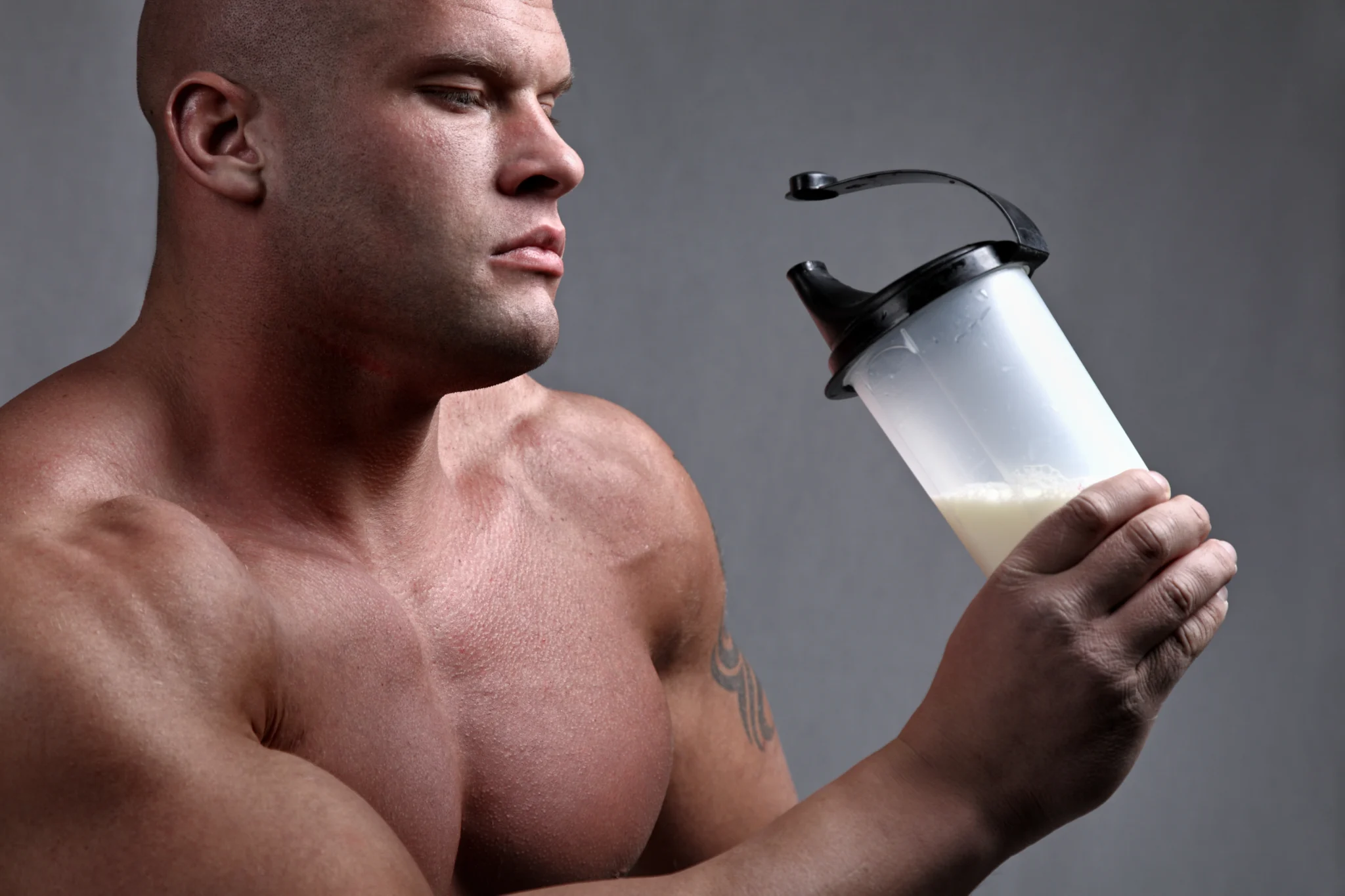 Bodybuilder with protein shake