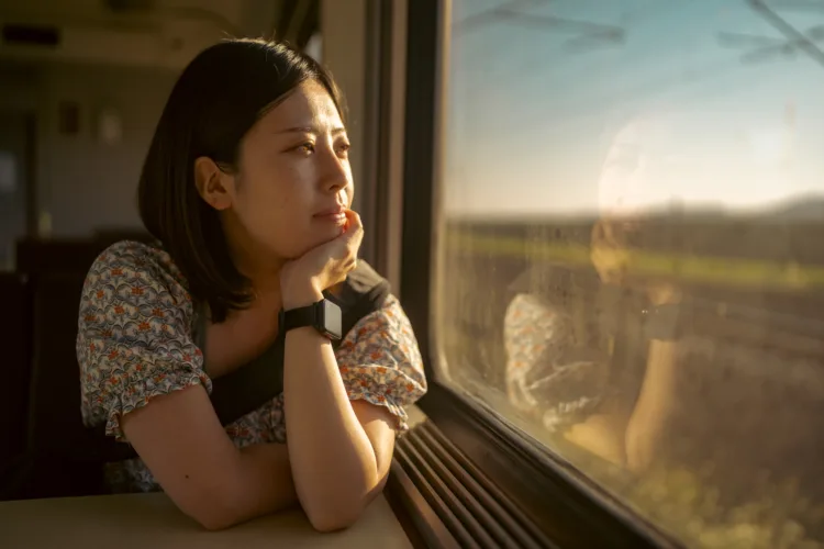 Young woman on a train maladaptive daydreaming